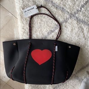 Ah-dorned neoprene heart tote